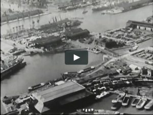 Aerial view of Docklands in the 1951 black and white documentary short Waters of Time.