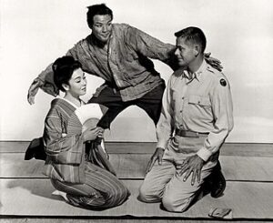 Machiko Kyō, Marlon Brando, and Glenn Ford in The Teahouse of the August Moon.