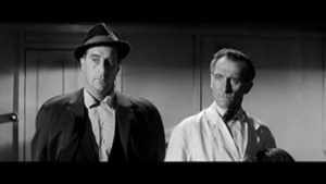 Nigel Green and Peter Cushing in The Man Who Finally Died (1963). 