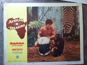 Bomba (Johnny Sheffield) shows his skill as a jungle drummer.