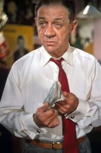 Sidney James plays pub landlord Eric Hace.